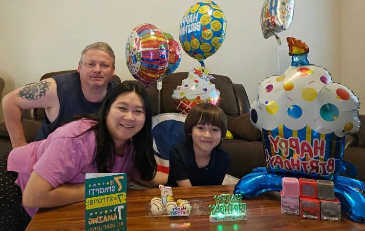 Charm with her family at a birthday celebration